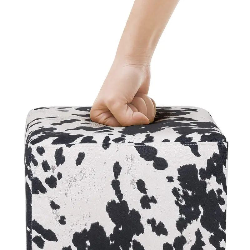 Puf cúbico con estampado de vaca, negro y marrón, reposapiés individual