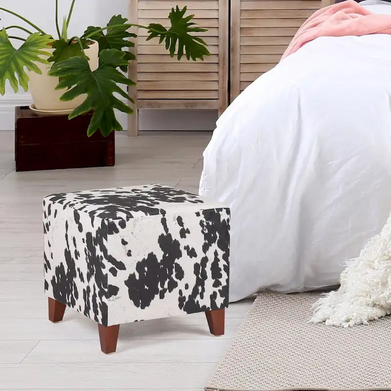 Puf cúbico con estampado de vaca, negro y marrón, reposapiés individual