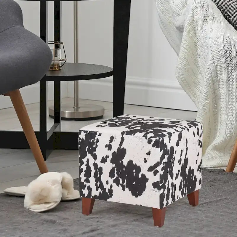 Puf cúbico con estampado de vaca, negro y marrón, reposapiés individual