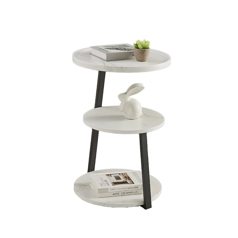 Mesa auxiliar redonda de tres niveles en blanco y negro con patas metálicas asimétricas