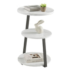 Mesa auxiliar redonda de tres niveles en blanco y negro con patas metálicas asimétricas