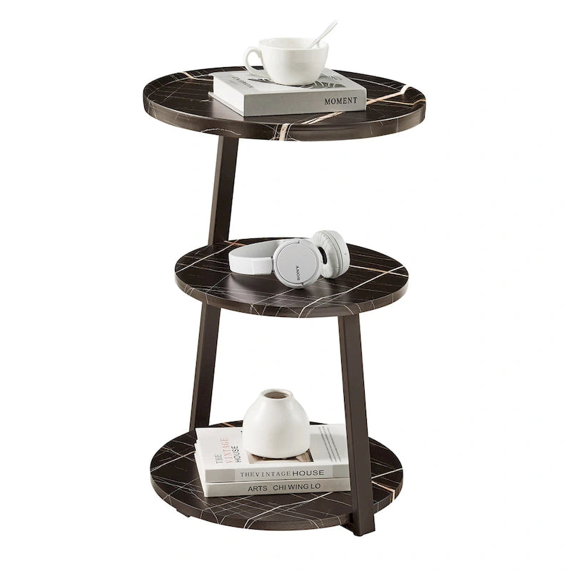 Mesa auxiliar redonda de tres niveles en blanco y negro con patas metálicas asimétricas